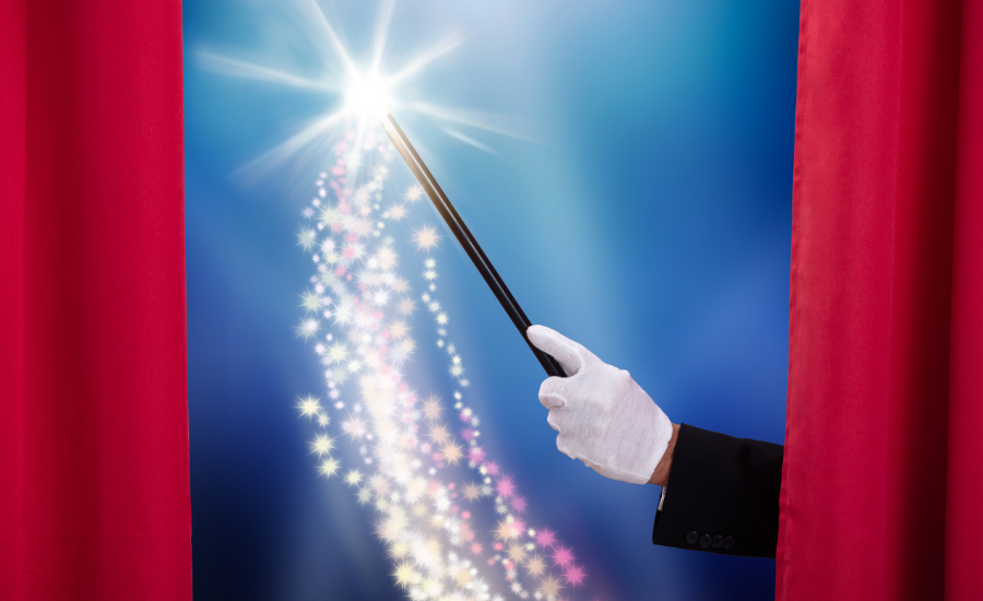 Image of a magicians wand behind red curtains, demonstrating the question; "Does it take magic to find your dream job?"